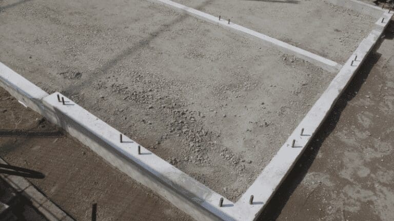 a concrete slab is being constructed in the middle of a yard