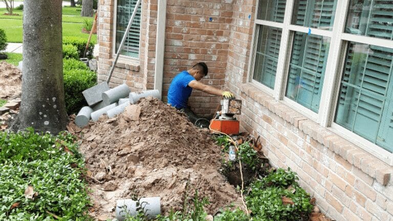 a man with a machine is digging in the dirt