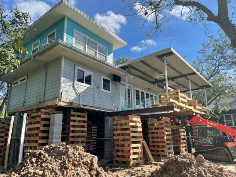 a house being built with wooden pallets