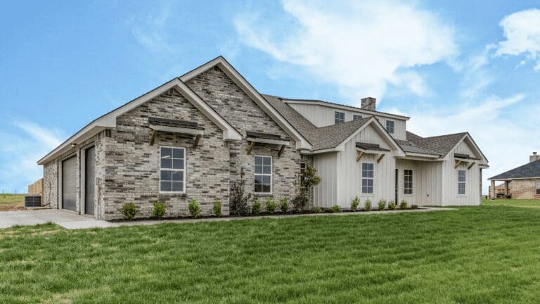 a house with a large lawn in front of it