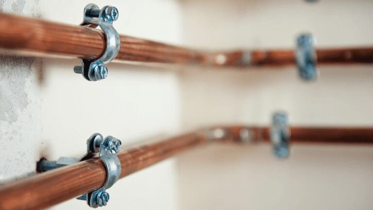 the pipes are lined up on the wall