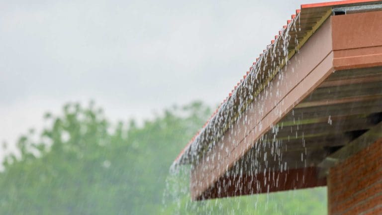 a rain gutter attached to the side of a building