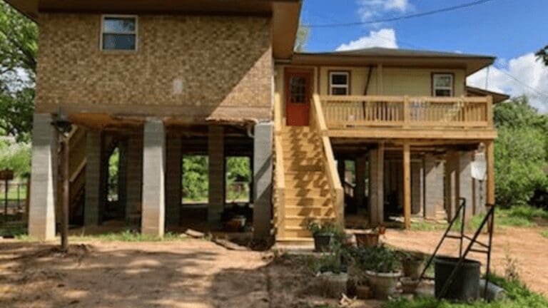 a house that is under construction in the dirt