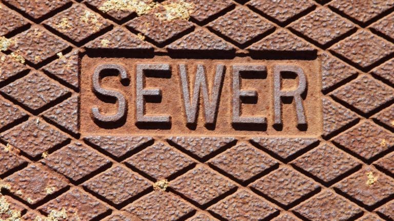 the word sever written in metal on a brick wall