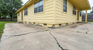 Houston home exhibiting foundation issues with visible cracks and uneven surfaces